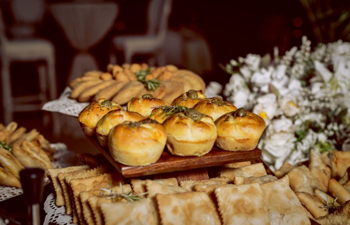 A variety of freshly baked pastries and breads artfully arranged at an event in Luanda, Angola.