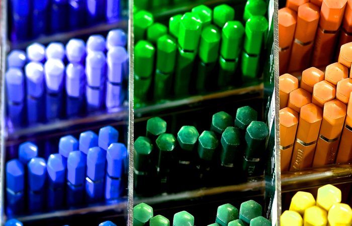 Colorful array of pencils in a store display, showcasing vibrant shades.